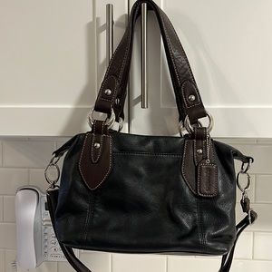 Black leather bag with brown accents and handles by St John’s Bay